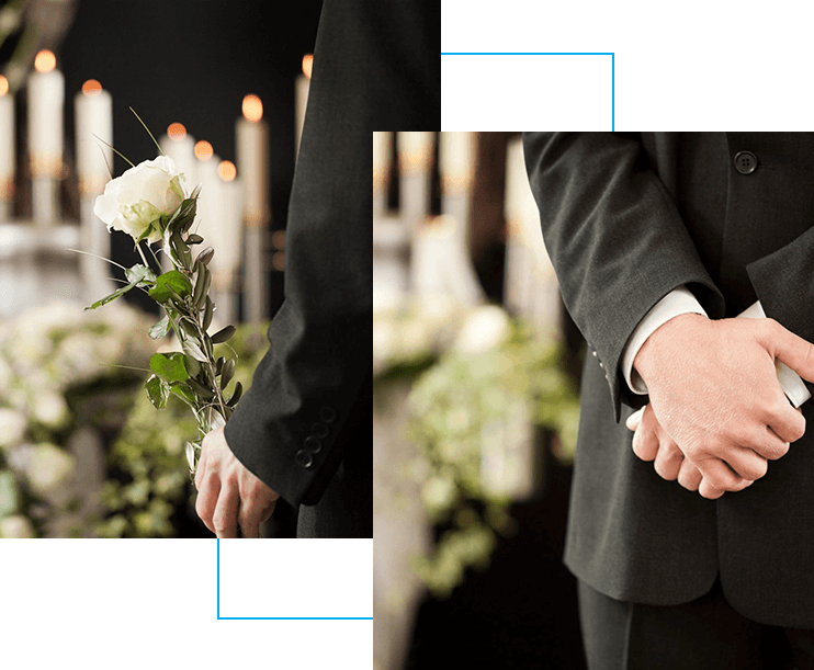 Two men holding hands in front of a funeral.