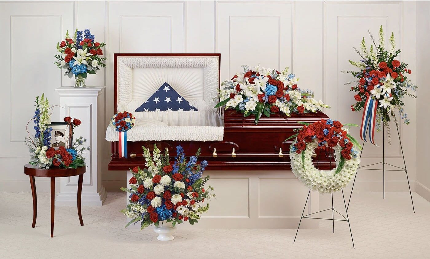 A casket with an american flag on it.