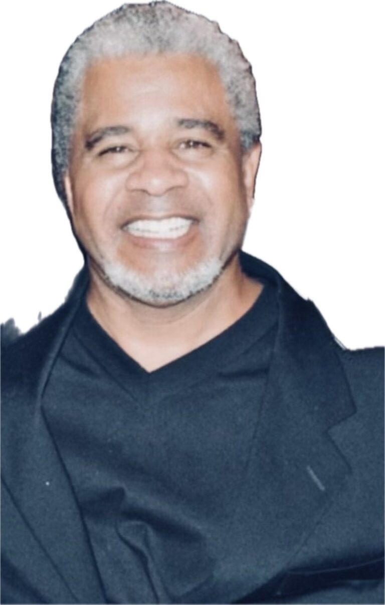 Smiling man in a black jacket.