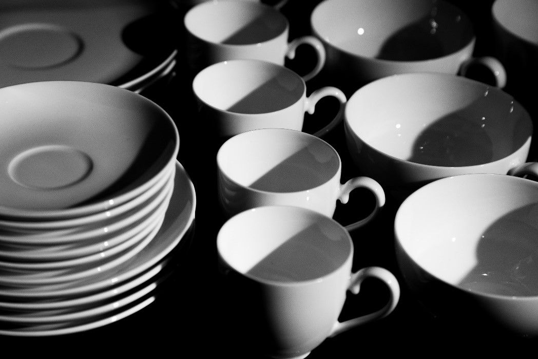 A table with plates and cups on it