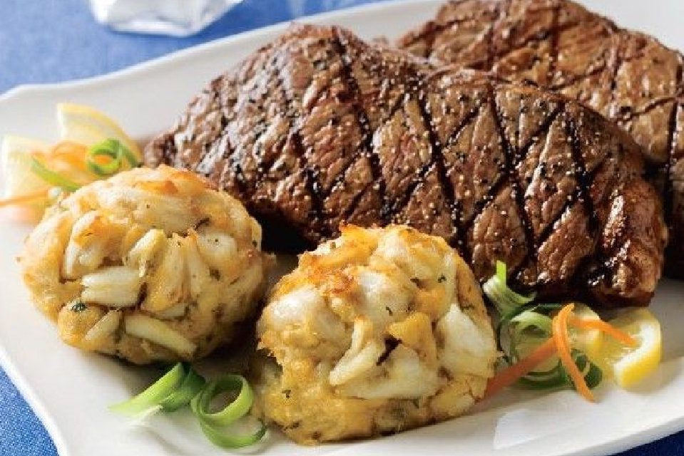 A plate of food with meat and vegetables on it.