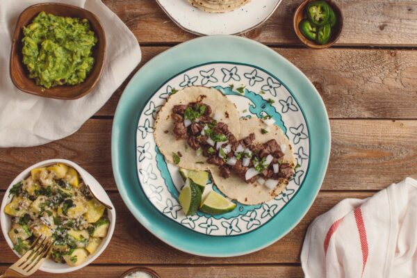 A plate of food on top of a wooden table.